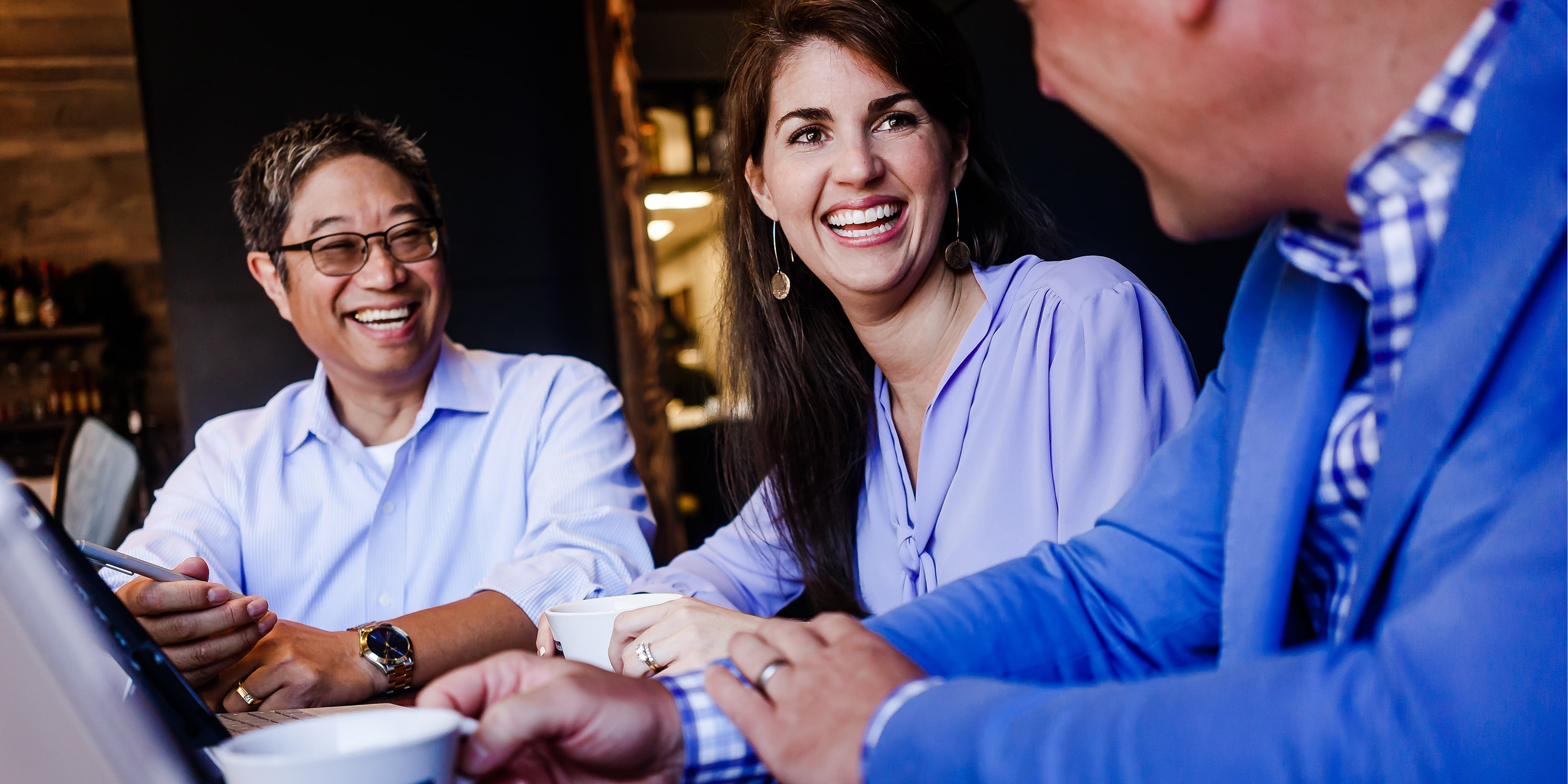 Image of Paragon Financial team chatting over coffee